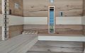 Große Sauna mit zwei Infrarotstrahlern und LED-Einbaustrahlern als Deckenbeleuchtung, Außenverkleidung in Altholz, Innenverkleidung in Eiche "crack", Einrichtung in Espe - Innenansicht, Bankanlage