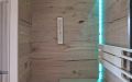 Kleine Sauna in Eiche mit abgeschrägter Glasfront, Infrarotstrahler, Sternenhimmel und LED-Beleuchtung - Innenansicht, LED-Beleuchtung, türkis